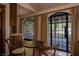 The bedroom features a table with seating and access to the backyard at 1450 Rancho Cir, Las Vegas, NV 89107