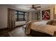 This bedroom features a ceiling fan and a lovely throw blanket at 1450 Rancho Cir, Las Vegas, NV 89107