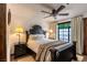 Bedroom with a ceiling fan, large window and view to the outside at 1450 Rancho Cir, Las Vegas, NV 89107