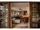 Luxurious primary bedroom suite featuring wood floors, leather chairs and plenty of natural light at 1450 Rancho Cir, Las Vegas, NV 89107