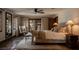 Elegant bedroom featuring beautiful tile floors, plush bedding, and lots of natural light at 1450 Rancho Cir, Las Vegas, NV 89107