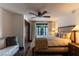 Comfortable bedroom with a ceiling fan, large window and view to the outside at 1450 Rancho Cir, Las Vegas, NV 89107