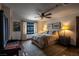 This bedroom features a ceiling fan, large windows, and modern art at 1450 Rancho Cir, Las Vegas, NV 89107