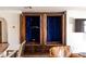 A custom wood built-in with dark wood cabinets and shelving. The shelves are empty at 1450 Rancho Cir, Las Vegas, NV 89107