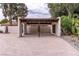 View of the carport with a tile roof and privacy walls, providing sheltered parking at 1450 Rancho Cir, Las Vegas, NV 89107