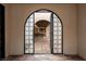Elegant entryway features a decorative iron gate leading to a spacious interior at 1450 Rancho Cir, Las Vegas, NV 89107