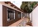 Home exterior features a unique walkway with rocks, desert landscaping, and a tiled roof at 1450 Rancho Cir, Las Vegas, NV 89107