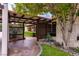 Inviting front entrance with stone walkway, decorative metal gate and mature landscaping at 1450 Rancho Cir, Las Vegas, NV 89107