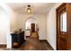 Welcoming hallway with decorative lighting leading to kitchen area and rooms at 1450 Rancho Cir, Las Vegas, NV 89107
