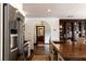 Bright kitchen featuring stainless appliances, custom wood cabinets, and views of the home at 1450 Rancho Cir, Las Vegas, NV 89107