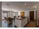 Open concept kitchen and living space with a kitchen island and cozy seating at 1450 Rancho Cir, Las Vegas, NV 89107