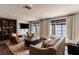 Bright and spacious living room features neutral colors, large windows, and decorative shelving at 1450 Rancho Cir, Las Vegas, NV 89107
