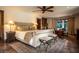 Large main bedroom with decorative lamps, tile flooring, direct access to outdoor patio area, and comfortable cushioned seating at 1450 Rancho Cir, Las Vegas, NV 89107