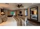 Relaxing bedroom with a soft bed, mirrored wall, and outdoor access at 1450 Rancho Cir, Las Vegas, NV 89107