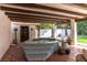 Relaxing outdoor hot tub with tile border, set in a private patio with a covered pergola at 1450 Rancho Cir, Las Vegas, NV 89107