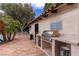 Outdoor kitchen area with built-in grill and countertop space perfect for al fresco dining at 1450 Rancho Cir, Las Vegas, NV 89107
