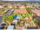 Aerial view showcasing the community pool, mature landscaping, carports, and multi-story buildings at 5751 Hacienda Ave # 135, Las Vegas, NV 89122