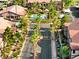 An aerial view of a gated community, showcasing the pool, landscaping, and well-maintained buildings at 5751 Hacienda Ave # 135, Las Vegas, NV 89122
