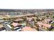 Aerial view of condo complex, including the swimming pool, parking areas and surrounding neighborhood at 5751 Hacienda Ave # 135, Las Vegas, NV 89122