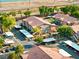 Aerial view showcasing the community buildings, carports, mature trees, and well maintained landscape at 5751 Hacienda Ave # 135, Las Vegas, NV 89122