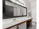 Bathroom with white vanity, large mirror, and tile flooring at 5751 Hacienda Ave # 135, Las Vegas, NV 89122