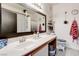 Clean and well-lit bathroom with a large mirror, vanity, and shower at 5751 Hacienda Ave # 135, Las Vegas, NV 89122