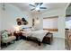 Comfortable bedroom featuring a ceiling fan, natural light, and stylish decor at 5751 Hacienda Ave # 135, Las Vegas, NV 89122