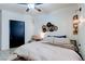Cozy bedroom with a ceiling fan, a closet, a comfortable bed, and a small chair at 5751 Hacienda Ave # 135, Las Vegas, NV 89122