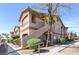 Condominium building exterior featuring well-maintained landscaping, walkways, and a neutral color scheme at 5751 Hacienda Ave # 135, Las Vegas, NV 89122