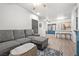 Open-concept living area with kitchen, barstools, and comfortable seating at 5751 Hacienda Ave # 135, Las Vegas, NV 89122