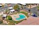 Aerial shot of community pool with lounge chairs, spa, and manicured landscaping, offering a relaxing oasis at 5751 Hacienda Ave # 135, Las Vegas, NV 89122