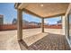 Covered backyard patio with a brick surface at 5913 Flowering Hill Ct, Las Vegas, NV 89131