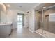 Modern bathroom featuring neutral colors, glass shower, and an open doorway to the bedroom at 5913 Flowering Hill Ct, Las Vegas, NV 89131