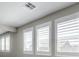 Bright bedroom with shuttered windows and modern ceiling fixtures at 5913 Flowering Hill Ct, Las Vegas, NV 89131