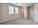 Neutral bedroom with grey carpet, bright windows, and white trim at 5913 Flowering Hill Ct, Las Vegas, NV 89131