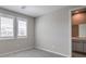 Cozy bedroom with plush carpeting and natural light from the shuttered windows at 5913 Flowering Hill Ct, Las Vegas, NV 89131