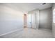 Neutral-toned bedroom with carpet, closet, and natural light from the windows at 5913 Flowering Hill Ct, Las Vegas, NV 89131