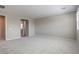 Bright bedroom with plush carpeting, light gray walls, and views to the bathroom at 5913 Flowering Hill Ct, Las Vegas, NV 89131