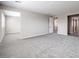 Bright bedroom with plush carpeting and an open doorway to the en suite bathroom at 5913 Flowering Hill Ct, Las Vegas, NV 89131