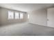 Spacious bedroom with plush carpeting, light gray walls, and large shuttered windows at 5913 Flowering Hill Ct, Las Vegas, NV 89131