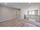 Bright bonus room with light gray walls, recessed lighting, and glass railing at 5913 Flowering Hill Ct, Las Vegas, NV 89131