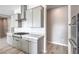 Well-equipped kitchen with gray cabinetry, stainless steel appliances, and ample counter space at 5913 Flowering Hill Ct, Las Vegas, NV 89131