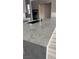 Close-up of a kitchen island featuring a stunning countertop and a modern sink fixture at 5913 Flowering Hill Ct, Las Vegas, NV 89131