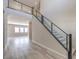 Bright and open entry way with a staircase and light wood flooring at 5913 Flowering Hill Ct, Las Vegas, NV 89131