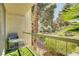 Balcony with green turf, outdoor furniture, and views of mature trees at 725 N Royal Crest Cir # 214, Las Vegas, NV 89169