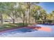 Community basketball court with trees providing shade at 725 N Royal Crest Cir # 214, Las Vegas, NV 89169