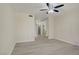 Bedroom with laminate floors, ceiling fan, and mirrored closet, offering ample space at 725 N Royal Crest Cir # 214, Las Vegas, NV 89169