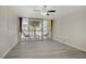 Inviting bedroom with sliding glass doors leading to balcony with chairs and table at 725 N Royal Crest Cir # 214, Las Vegas, NV 89169