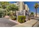 Attractive building entrance with well-maintained landscaping, creating a welcoming curb appeal at 725 N Royal Crest Cir # 214, Las Vegas, NV 89169