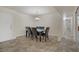 Comfortable dining room with hanging chandelier, tile flooring, and a seating for six at 725 N Royal Crest Cir # 214, Las Vegas, NV 89169